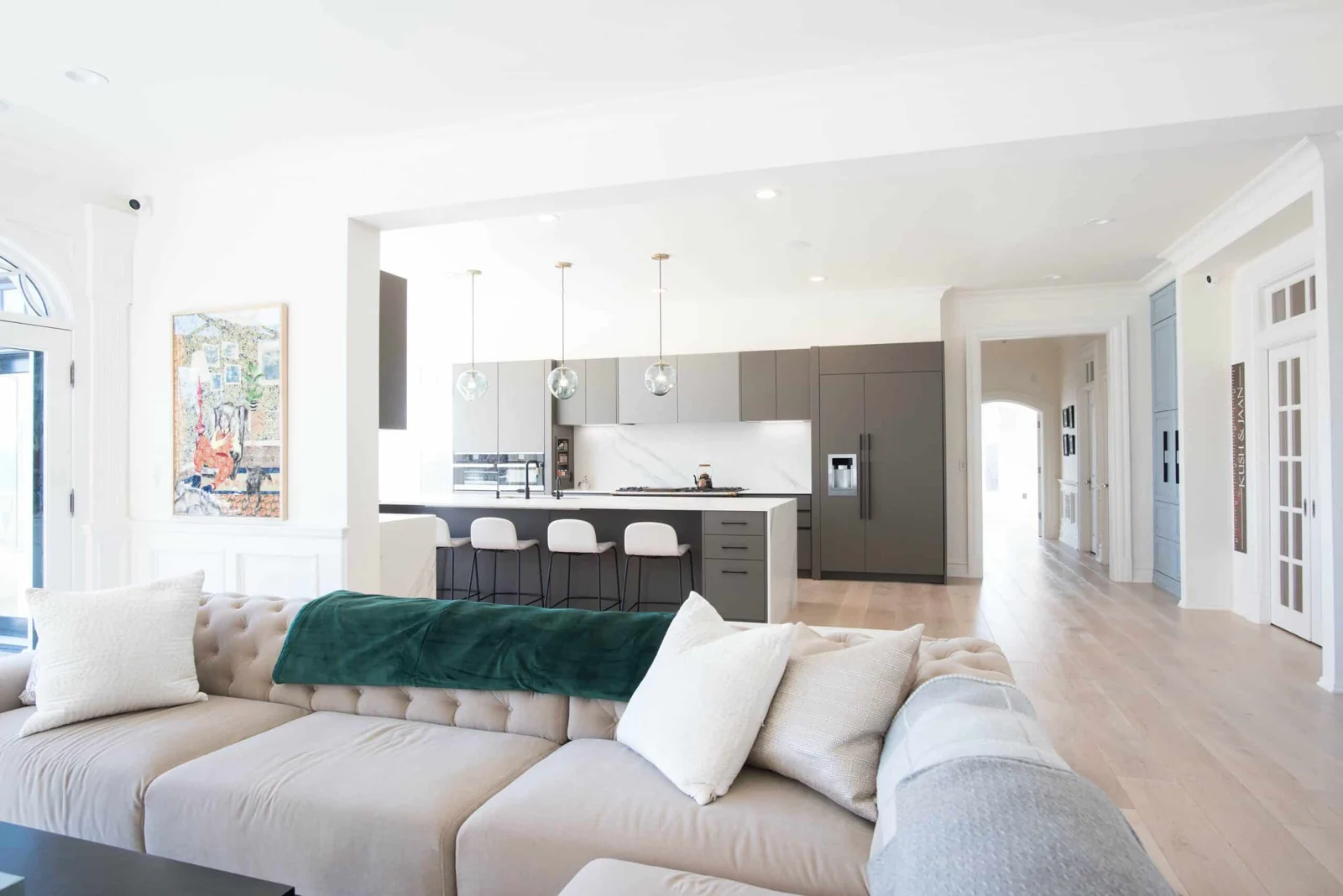 Bright renovated living room opening onto a modern kitchen