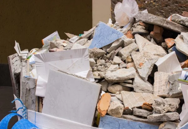 Broken tile and masonry debris collected for construction cleanup